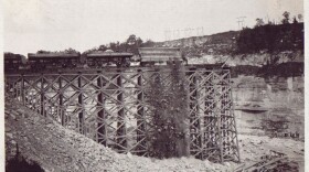 1923-1924 Rail cars dump rock to build Dix Dam