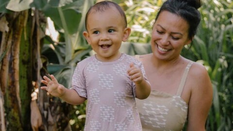 Courtney Lazo and her youngest son, Henōhea, model clothing from her brand named after him.