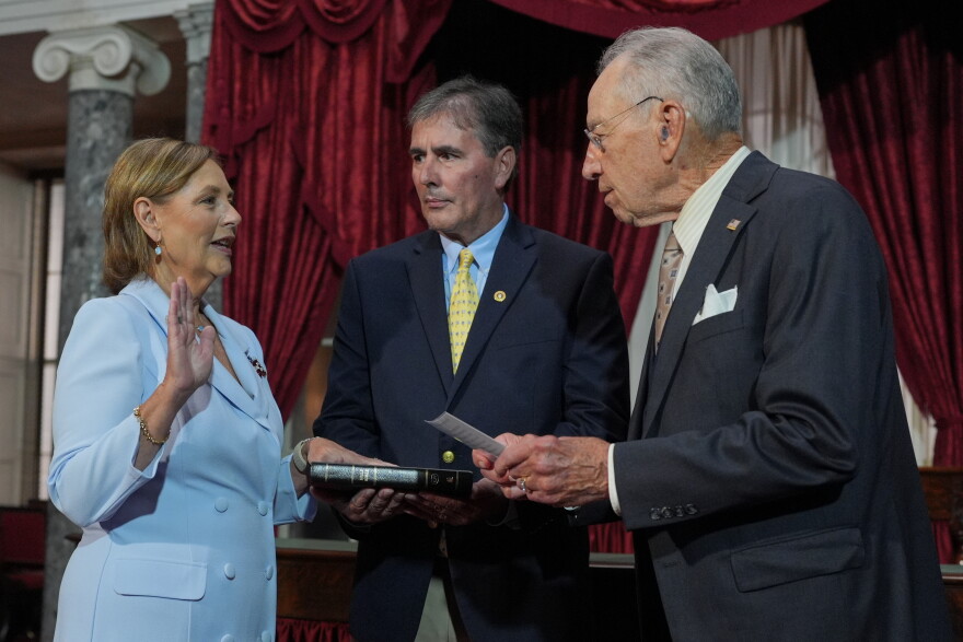 Darline Graham, sister of Sen. Lindsey Graham, R-S.C., is ceremonially sworn-in by President Pro Tempore of the Senate, Chuck Grassley, R-Iowa, in the Old Senate Chamber at the Capitol in Washington, Tuesday, July 14, 2026, as her husband Larry Nordone holds the Bible. (AP Photo/J. Scott Applewhite)