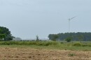 A wind turbine rises above farmland in Chowan County, N.C. on Tuesday, Sept. 24, 2024.