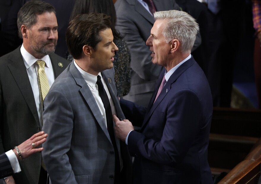 House Republican Leader Kevin McCarthy (R-CA) (L) talks to Rep.-elect Matt Gaetz (R-FL) in the House Chamber after Gaetz voted present during the fourth day of voting for Speaker of the House.