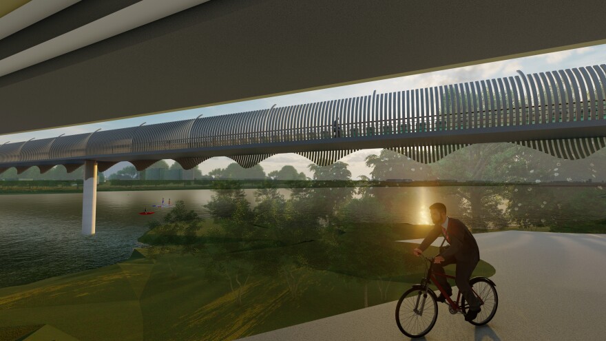 An illustration depicting a view from under the I-35 bridge showing the standalone pedestrian bridge across Lady Bird Lake. A man is riding a bicycle along a trail.