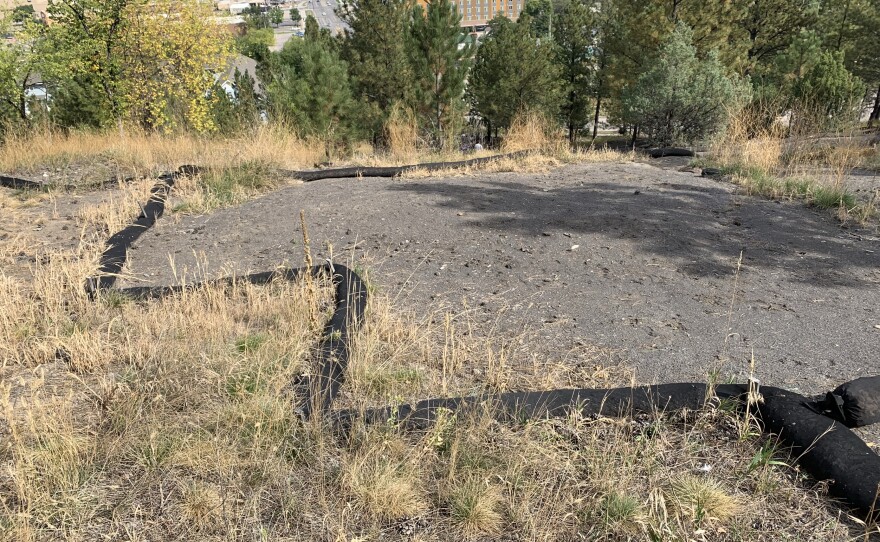 The black wattle serves as a catch for any loose sediment. The difference between the healthy and unhealthy soils can be seen on either end of the wattle.