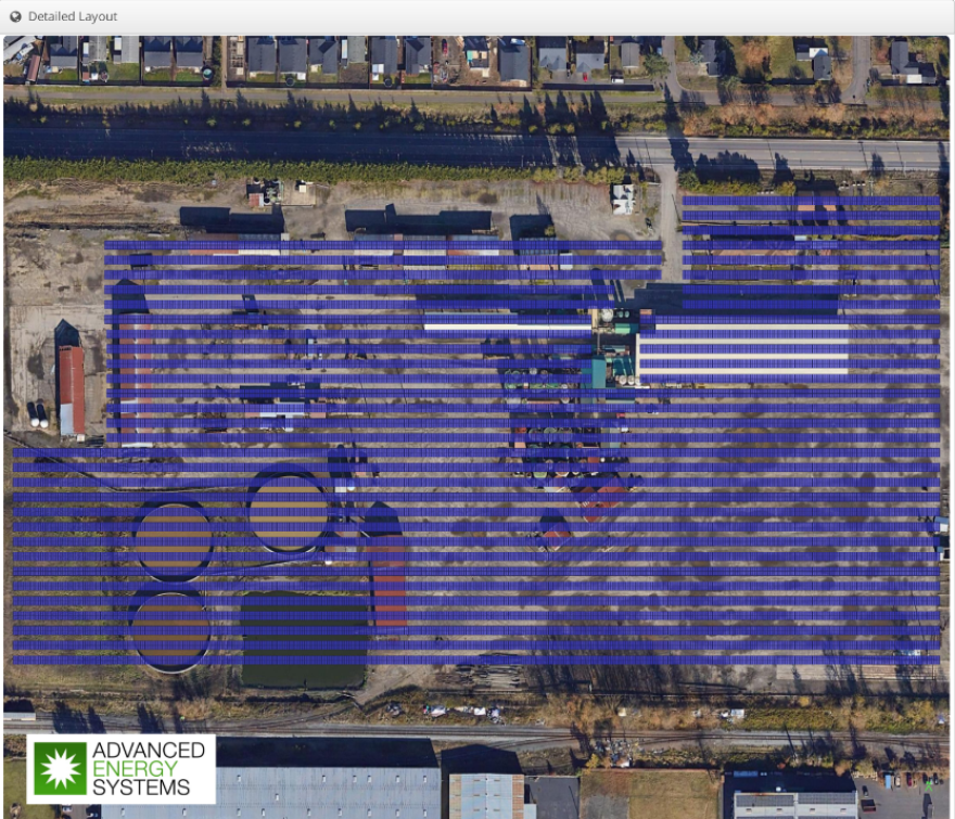 Solar panels across an old industrial site.