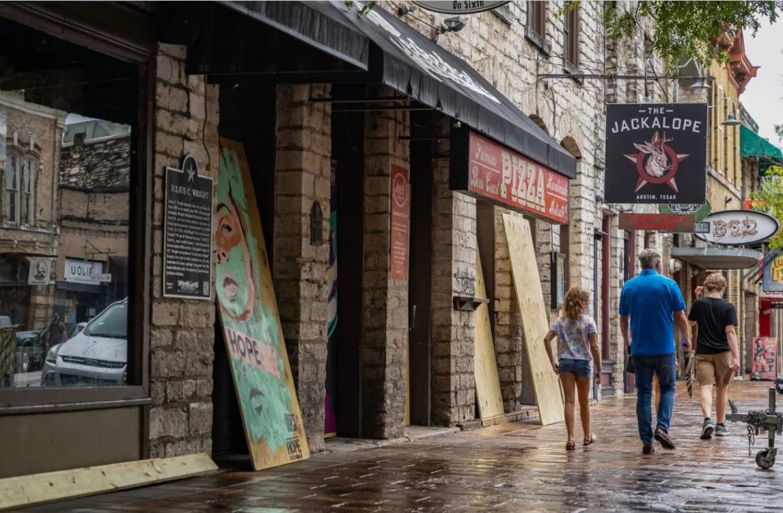 Workers boarded up bars on West 6th Street in Austin after Gov. Greg Abbott ordered them closed for the second time in three months on June 26.