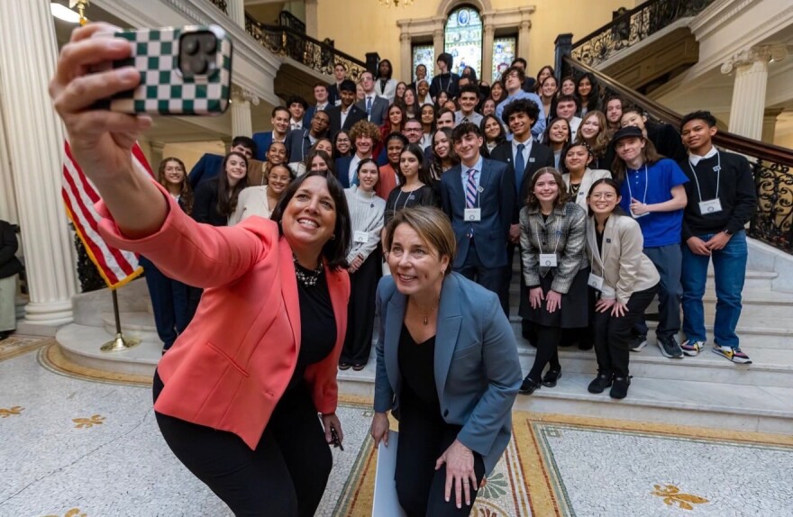 Lieutenant governor Kim Driscoll takes a selfie with Governor Maura Healey and her first youth advisory council.