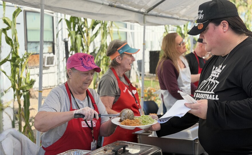 Volunteers serve meals at the Crossroads Rescue Mission's three days of Thanksgiving on November 25, 2025.