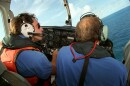 FILE - Brothers to the Rescue pilot Ivan Domaniewicz, left, and co-pilot Carlos Costa fly over the Straits of Florida looking for people who might have been on makeshift rafts fleeing Cuba in August 31, 1993. (File)