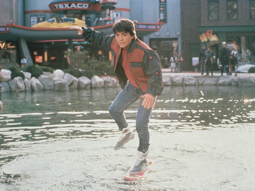 In <em>Back to the Future Part II,</em> Marty McFly (Michael J. Fox) slips on his Nike sneakers and rides a Mattel hoverboard in front of a Texaco gas station.