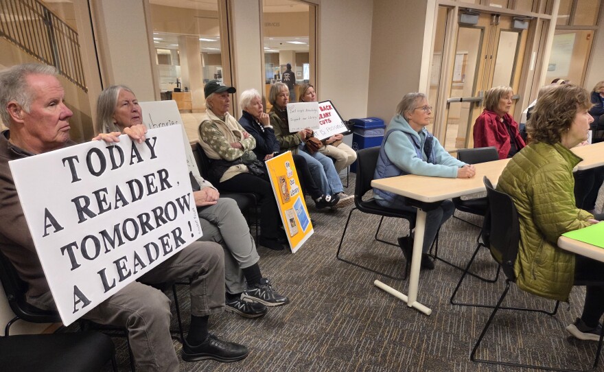 Supporters of the Bemidji Public Library attend the Beltrami County Board of Commissioners' work session on Nov. 4, 2025, some carrying signs or dressing as books or favorite literary characters.