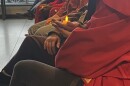 Audience members held candles during the vigil for the Transgender Day of Remembrance event at America's Black Holocaust Museum.