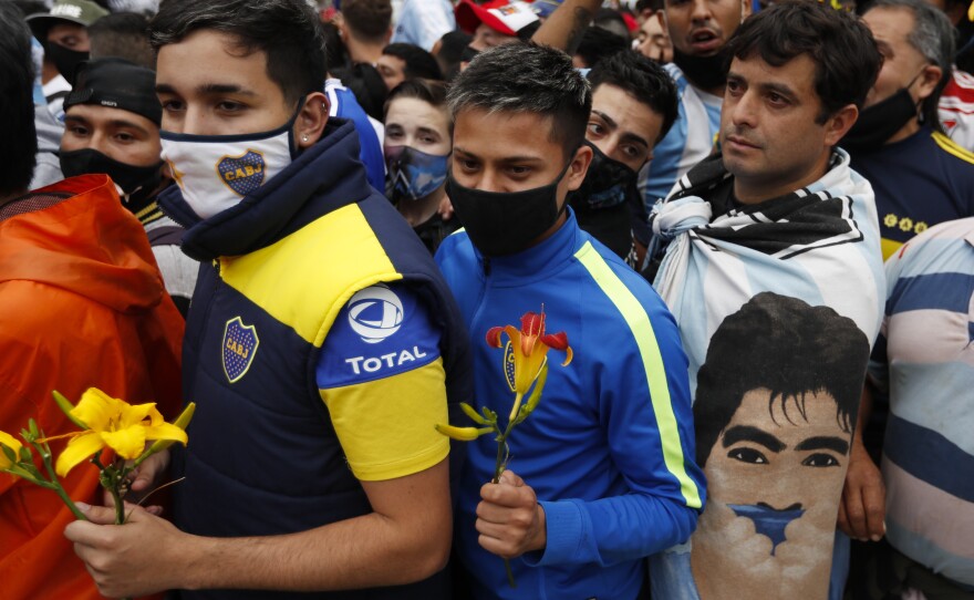 Fans line up to pay respects to Diego Maradona at the presidential palace in Buenos Aires on Thursday.