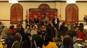 Four panelists speak to members and visitors at Tampa Tiger Bay Club.