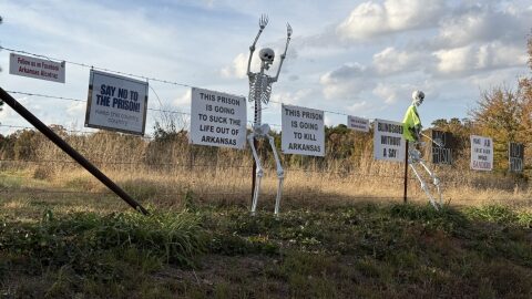 Signs of opposition to the Franklin County prison decorated the fence directly across the street from the prison site’s entrance on Arkansas Highway 215 on Nov. 13, 2025