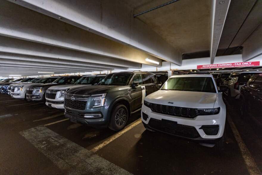 A row of brand new SUVs parked in the garage behind 800 District Avenue reserved for FAA. (Jesse Costa/WBUR)