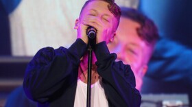 Macklemore performs onstage during the Capital One Orange Bowl Beach Bash in December in Miami Beach.
