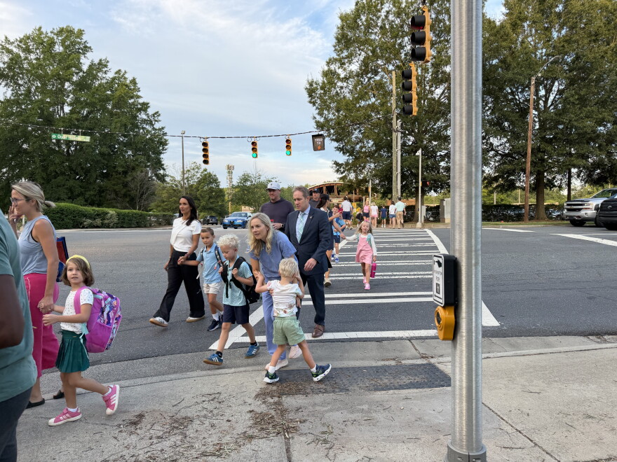 Students and parents walk into Beverly Woods Elementary School on the first day of the 2026-27 school year.