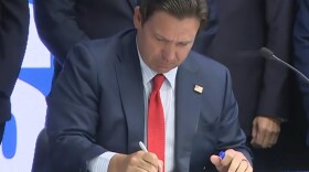 Gov. Ron DeSantis signed HB 757 into law during a ceremony at Miami Dade College in Miami on Friday.