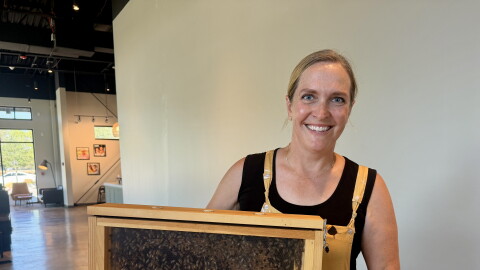 Author Shanna Upchurch shows off some of her bees as part of her appearance at Brittany's Favorite Things in Melissa.