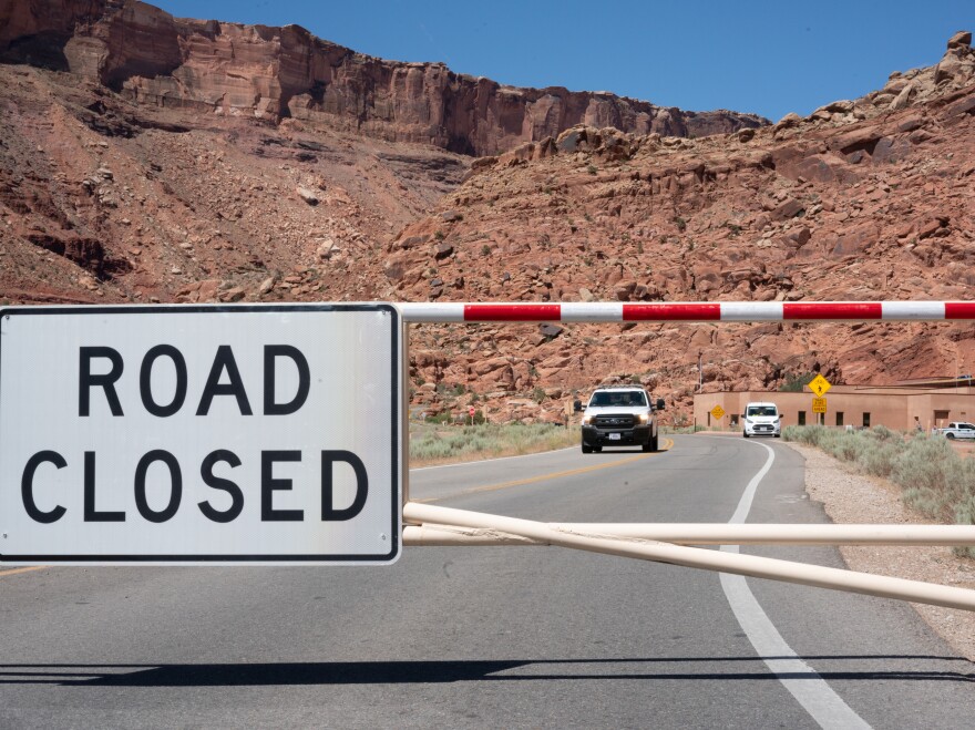 The gate to Arches National Park is closed on a weekday morning last month, as it is many mornings after the parking lots and trails quickly fill up.