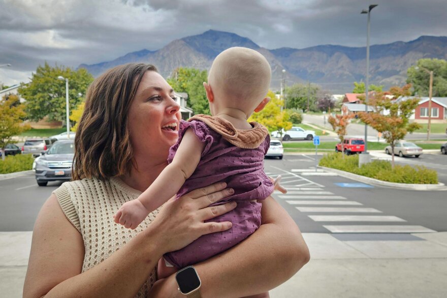 Krystle Kirkpatrick, IRS worker and National Treasury Employees Union Chapter 67 member, holds her 8-month-old niece, Oct. 11, 2025.