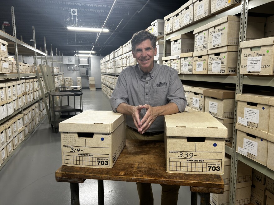Dayton History President and CEO, Brady Kress and some of the thousands of NCR related documents now being stored at the Mark and Paula Hurd NCR Archive Center.