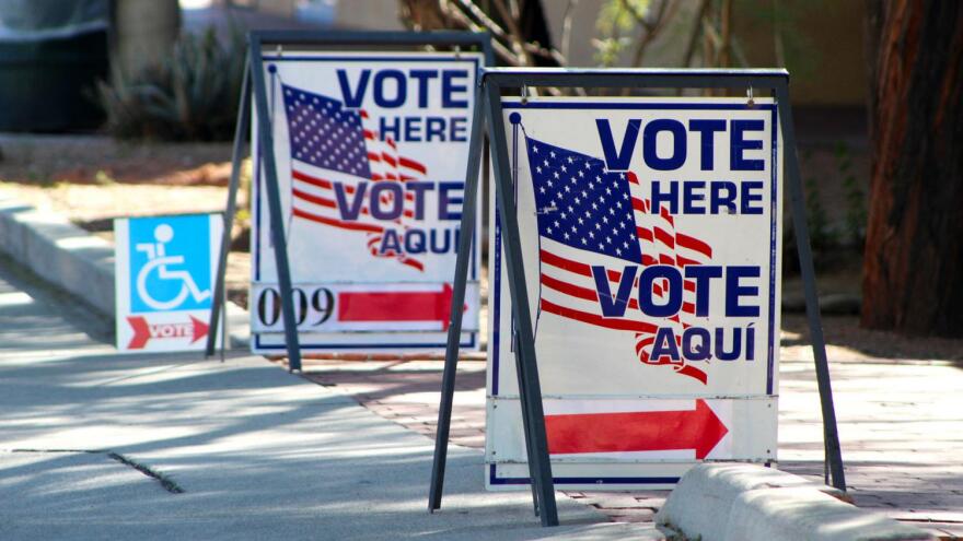 Vote center signs sit outside the Armory Park Center 