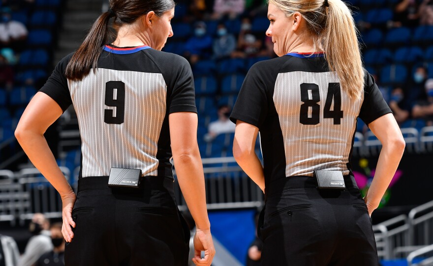 Referees Natalie Sago #9 and Jenna Schroeder #84 during the game between the Charlotte Hornets and Orlando Magic on January 25, 2021 in Orlando. It was the first time two women officiated an NBA game.