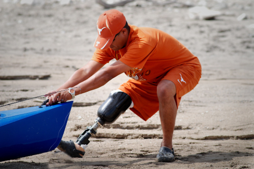 Veteran bringing in his kayak on 2009 Heroes On The Water trip, courtesy of Joe Winston- photographer.