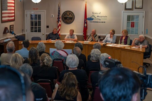 The Mountain City Board of Mayor and Aldermen hear from locals at a town hall meeting on Thursday, Aug. 7, 2025. In a packed room of 50, 11 residents voiced their concerns that plans to build a 30 megawatt bitcoin mine in a residential part of Mountain City were being rushed by city leaders without proper input from the people who live nearby.