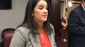 Sen. Anitere Flores speaking with reporters following a 2017 meeting of the Senate Banking Committee