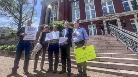 Advocates for protections for survivors of childhood sexual abuse speak in front of the Missouri Supreme Court building prior to delivering a letter to the Missouri Attorney General.