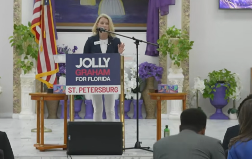 Woman speaking at a podium