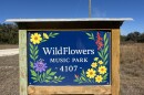 The colorful WildFlowers Music Park sign that greets people as they pull into the property.