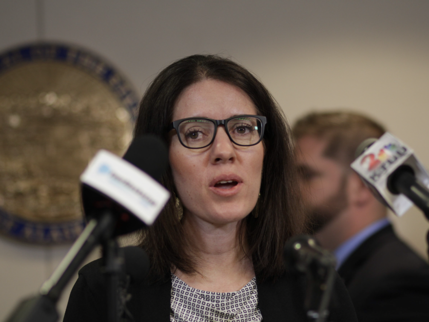 Dr. Anne Zink, Alaska's chief medical officer shown here at a press conference in March, has gotten praise from residents for her approach to dealing with the coronavirus outbreak. [Nathaniel Herz / Alaska Public Media]
