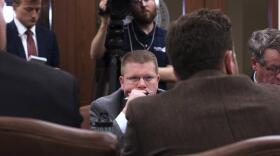  Lawmakers sit in the House Joint Committee on Appropriations and Budget on Tuesday night.