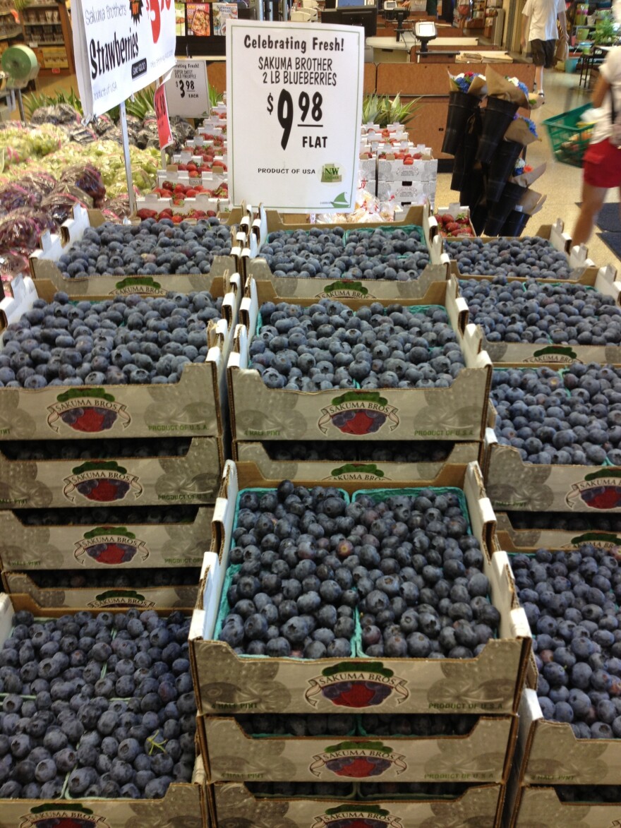 Flats of blueberries from Sakuma Brothers Farms are seen at Ballard Market in Seattle in 2013.