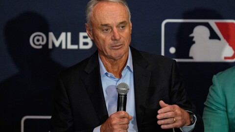  Rob Manfred, commissioner of Major League Baseball answers questions during a news conference at the MLB winter meetings, Dec. 8, 2025, in Orlando, Fla. (AP Photo/John Raoux, file)