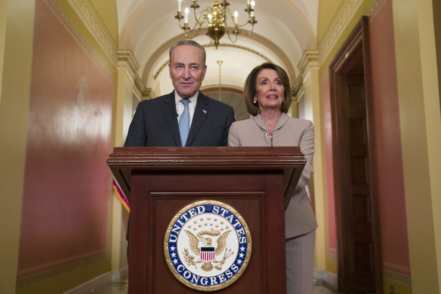 Senate Minority Leader Chuck Schumer of N.Y., and House Speaker Nancy Pelosi of Calif., pose for photographers after speaking on Capitol Hill in response President Donald Trump's address, Tuesday, Jan. 8, 2019, in Washington.