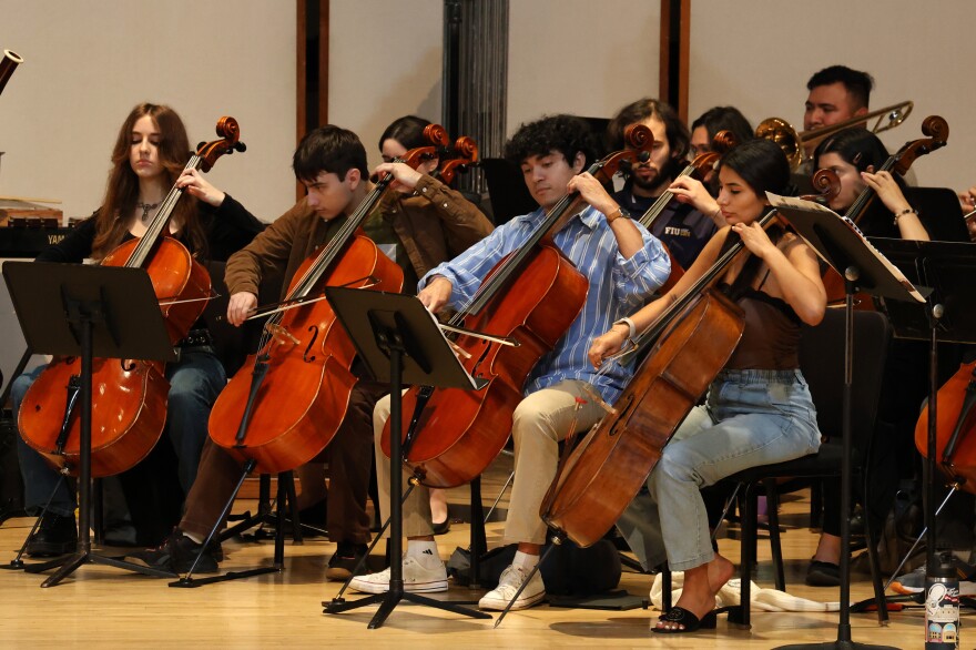 FIU Symphonic Orchestra cello players practice during a rehearsal at the Herbert and Nicole Wertheim School of Music & Performing Arts Nov. 18, 2025.