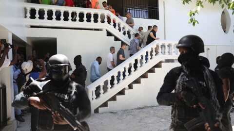 FILE - Colombians and Haitians who are accused of involvement in the 2021 assassination of Haitian President Jovenel Moise are escorted in handcuffs to their court hearing in Port-au-Prince, Haiti, May 26, 2025. (AP Photo/Odelyn Joseph, File)