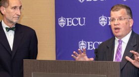 File photo of UNC System interim president Bill Roper, left, announcing that Dan Gerlach, right, will serve as ECU's interim leader.