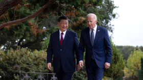 US President Joe Biden (R) and Chinese President Xi Jinping walk together after a meeting during the Asia-Pacific Economic Cooperation (APEC) Leaders' week in Woodside, California.