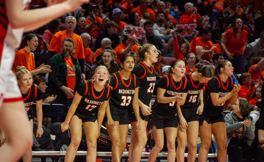 Girls high school basketball players inside an arena