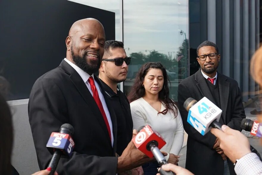 Attorney Thomas Bowers, Alberto Bernandino, Yeny Cartagena and Quinn Rallins speak at a press conference.