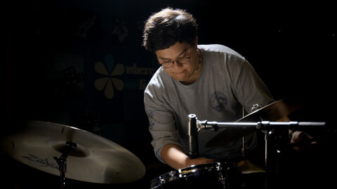Assistant Director of Radio Operations, prepares for a taping of the Colin McEnroe Show with drummer Molly Sayles March 13, 2026.