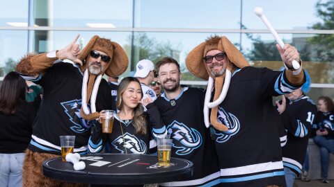 Utah Mammoth fans pose outside prior to an NHL hockey Stanley Cup playoff series against the Vegas Golden Knights, Friday, April 24, 2026, in Salt Lake City.