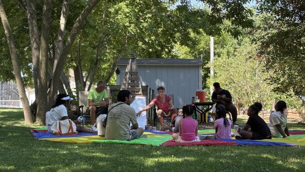 Lisa Roszkowski (center facing camera) introduces PEAK campers to the wonder of soil and compost on a recent summer morning.