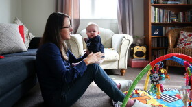 Secondary school teacher Sarah Ward at home on maternity leave with her three month old daughter Esme Kelliher, is in the last week of her paid parental leave allowance ahead of the New Zealand Federal Budget release, on May 5, 2015 in Auckland, New Zealand. (Fiona Goodall/Getty Images)