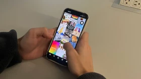 A student uses his phone in school.